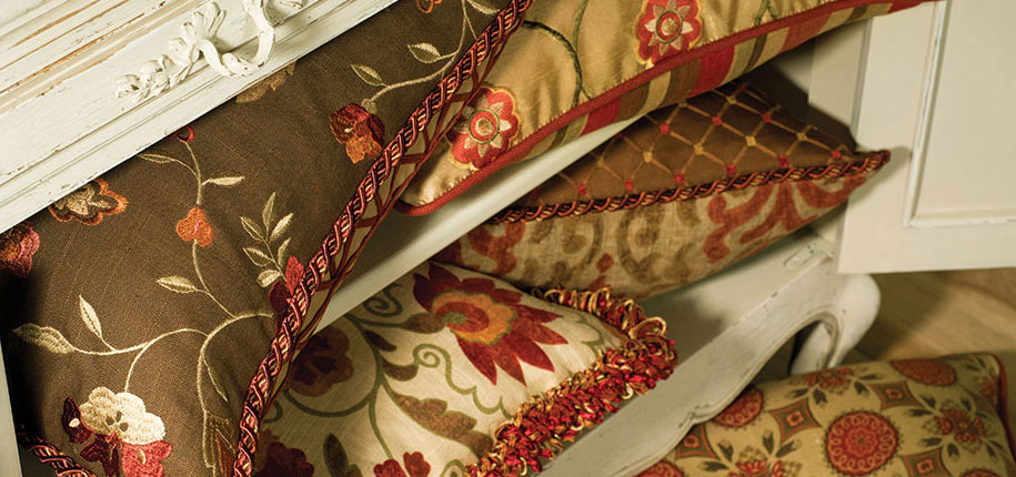 sandy drapes, seat cushions, striped, tan trending pillows and fabrics. vignettes close up view, bright pillows