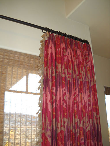 sandy drapes, seat cushions, striped, tan trending pillows and fabrics. vignettes close up view, bright pillows